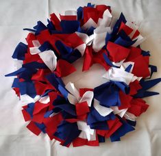 red, white and blue streamers are arranged in a circle