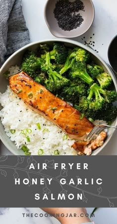 a bowl filled with rice, broccoli and salmon