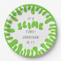 a green and white plate with the words it's slime time jonathan is 11