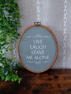 "This faux embroidery, also known as faux cross-stitch, would make a great addition to your entryway or home decor or give as a gift for any occasion!  * * *NOT HAND-STITCHED* * * Image/Text is printed with vinyl and set on your choice of colored fabric. Framed in a rubber woodgrain styled frame with brass-like hanger. Measures 6\" W x 7.5\" H.  * * *TO ORDER* * * *Select Fabric Color *Select Font Color *Select Quantity *ADD TO CART FREE USPS First Class Shipping on orders of $35 or more! *USA O Embroidery Swear Words, Faux Embroidery, Funny Home Decor, Subversive Cross Stitch, House Deco, Image Text, Cross Stitch Funny, Leave Me Alone, Needle Art