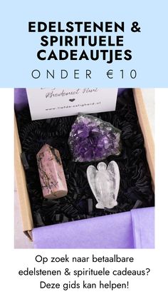 an open box with some rocks in it and the words, edelstenn & spirit