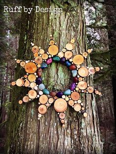 a tree with many different colored beads on it's bark and the words ruffby design