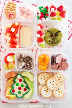 a plastic container filled with different types of food and snacks on top of a table