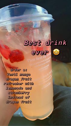 a person holding up a plastic cup with liquid in it and the caption best drink ever