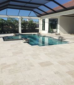 an empty swimming pool in the middle of a house