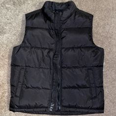 Old Navy Black Puffer Vest Size 6-7 Zipper Closure Pockets Old Navy Puffer Vest, Black Puffer Vest For Spring, Solid Winter Outerwear For School, Casual Black Outerwear For School, Black Spring Puffer Jacket For Outdoor Activities, Black Outerwear With Pockets For School, Black School Outerwear With Pockets, Black Puffer Vest For Winter, Black Winter Vest For Cold Weather