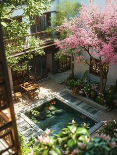 an aerial view of a courtyard with trees and flowers in blooming pots next to a pool