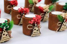 small wooden candles decorated with christmas decorations