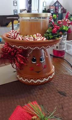 two tiered trays filled with candy canes on top of a wooden table