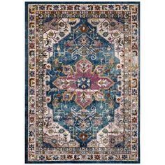 a blue rug with an ornate design on the front and back side, in various colors