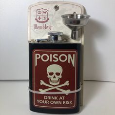 a metal flask with a skull and crossbones on the side that says poison drink at your own risk