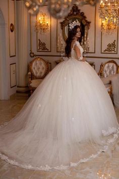 a woman in a wedding dress is posing for the camera