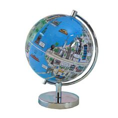 a small globe on a stand in front of a colorful background