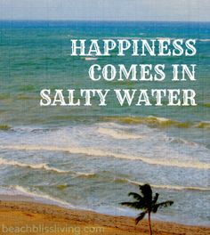 a palm tree sitting on top of a beach next to the ocean with words that read happiness comes in salty water