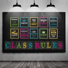 a chalkboard with the words class rules written on it in front of three lamps