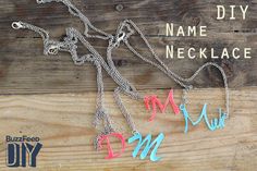 the name necklace is made out of metal chains