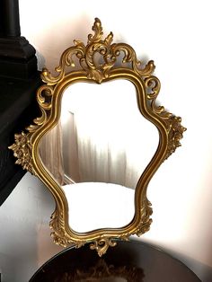 Vintage Syroco Mirror - 29" x 19" Add a touch of vintage elegance to your home with this stunning Syroco mirror. Measuring 29 inches by 19 inches, this ornate piece features a beautifully detailed frame, embodying the charm and craftsmanship of vintage decor. The intricate floral and scrollwork design adds a classic, timeless appeal, making it a perfect focal point for any room. This mirror is not only a functional item but also a piece of art that enhances the aesthetic of any space. Ideal for Vintage Mirror, Gold Mirror, Home Decor Mirrors, Focal Point, Vintage Charms, Vintage Floral, Vintage Decor, Mirror Decor, Shop House