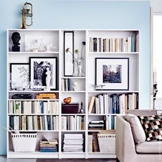 a living room filled with furniture and bookshelves covered in lots of different types of books