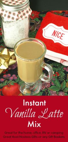 a cup of coffee sitting on top of a table next to a red napkin and two jars