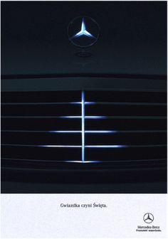 the front grille of a mercedes car with blue lights shining on it's grill