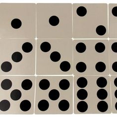 several white and black polka dots are arranged on the same square tile, each with one individual's own spot