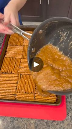 a person is making crackers in a pan