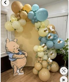 winnie the pooh balloon arch with balloons