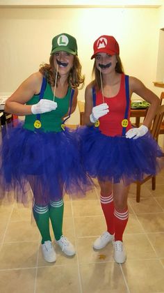 two women dressed up as mario and luigi