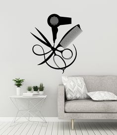 a wall decal with scissors and hairdryer on it in a living room