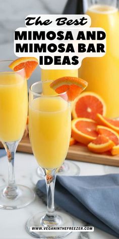 two glasses filled with orange juice and garnished with an orange slice on the rim