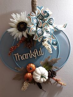 a blue plate with flowers and the words thank you on it