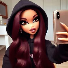 a doll holding up a cell phone to take a selfie