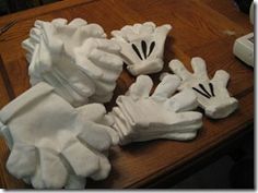 some white gloves sitting on top of a wooden table