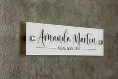 - White Wall Name Plate with Metal Stands & Mounting Fixtures. - Made of Acrylic (10x2.75 inches) - Personalization Included ♦ ORDER WORK FLOW: ♦ 1. In the personalization box, let us know the text that you would like to have engraved. 2. Once your order is placed, we'll send you a design mock-up for you to approve prior to production. We produce and ship within 3-5 business days. » NOTE FOR BUYERS: We do not ship products that are not approved so please keep an eye on your Etsy Inbox. Please al Office Door Name Plates, Door Name Tags, Commercial Bathroom Designs, Acrylic Items, Job Office, Door Office, Door Name Plates, Door Signage, Office Door Signs