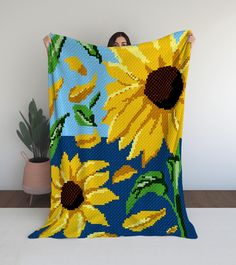 Embrace the warmth and beauty of sunflowers with our Sunny Blooms in a Field C2C Crochet Pattern. This exquisitely designed digital pattern will guide you through creating a stunning blanket that captures the vibrant colors and cheerful essence of a sunny field filled with blooming sunflowers. Perfect for adding a touch of nature-inspired charm to your home decor, crafting thoughtful gifts, or simply indulging in a delightful crochet project. Features: Dimensions: Generous size to keep you warm Crochet Sunflower Blanket, Sunny Field, Sunflower Blanket, C2c Crochet Pattern, Fields Of Flowers, Flowers Crochet, Cozy Wrap, Crochet Sunflower, Sunflower Field