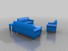 a blue couch and chair sitting next to each other on a gray flooring area