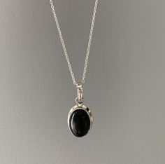 Sterling silver oval black onyx necklace Gift box available for purchase. Search GIFTBOX Gift Oval Cabochon Necklace With Polished Finish, Classic Oval Onyx Necklaces, Silver Oval Onyx Necklace, Black Oval Pendant Minimalist Jewelry, Silver Onyx Oval Necklace, Minimalist Black Oval Pendant Jewelry, Onyx Oval Pendant Jewelry For Gift, Onyx Oval Pendant Jewelry Gift, Black Onyx Oval Pendant Necklace