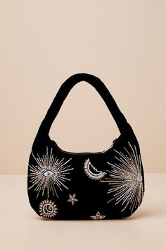 If you wish to shine bright like star, make sure to add a stunning accessory like the Lulus Dazzling Desire Black Velvet Beaded Shoulder Bag to your 'fit! This luxe velvet shoulder bag features an eye-catching, astral-inspired beaded design (including evil eye accents) that adorns both sides of the rectangular silhouette. A zipper top opens beneath the slender shoulder strap to reveal a lined interior with a sidewall pocket and plenty of carrying space. Lined. Bag 13. 25" Wide, 8. 25" Tall, And . 75" Deep(Relaxed). Handle has a 7" Drop. 50% Acrylic, 42% Glass, 8% Polyester. Shell: 100% Polyester. Lining 100% Cotton. Spot Clean Only. Imported. Lulus | Dazzling Desire Black Velvet Beaded Shoulder Bag | 100% Cotton. Beaded Embroidery Purse, Black Beaded Bag, Witchy Handbag, Velvet Diy, Celestial Embroidery, Black Cat Bag, Custom Jeans Diy, Women's Bag By Pattern, Velvet Accessories