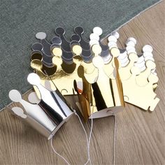 several pieces of metal sitting on top of a wooden table