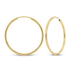 These continuous hoop earrings are fashioned in 14K yellow gold and are a stylish addition to her jewelry collection. The high polish finish gives extra shine, and the earrings measure 1.5x30mm and secure with endless backs. Gold Layered Bracelets, Pearl Diamond Jewelry, Cross Jewelry Necklace, Fan Jewelry, Cross Jewelry, Tennis Bracelet Diamond, Accessories Jewelry Earrings, Diamond Fashion, High Jewelry