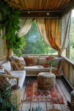 a covered porch with wicker furniture and plants