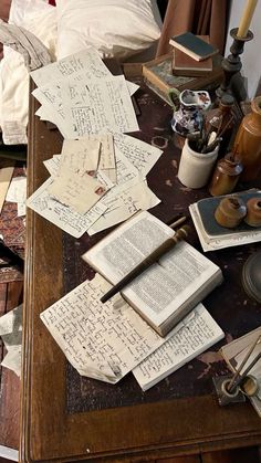 an old desk covered with papers and other items