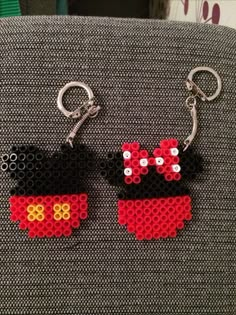 two mickey mouse keychains made out of legos