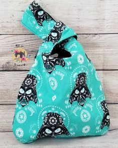 a blue bag with skulls on it