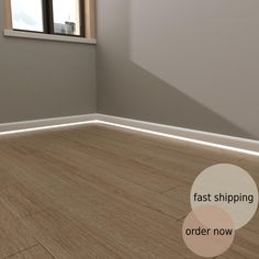 an empty room with wood flooring and a window in the corner that says fast shipping order now