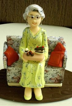 a figurine sitting on top of a table next to a couch