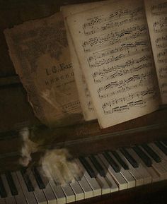 an old piano with sheet music on it