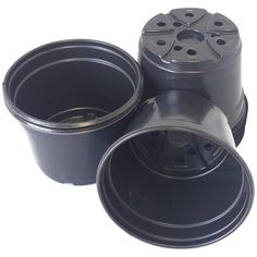 four black plastic containers are stacked on top of each other