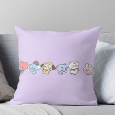 a group of cartoon animals sitting on top of a couch next to each other throw pillow