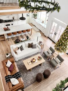 an overhead view of a living room and kitchen